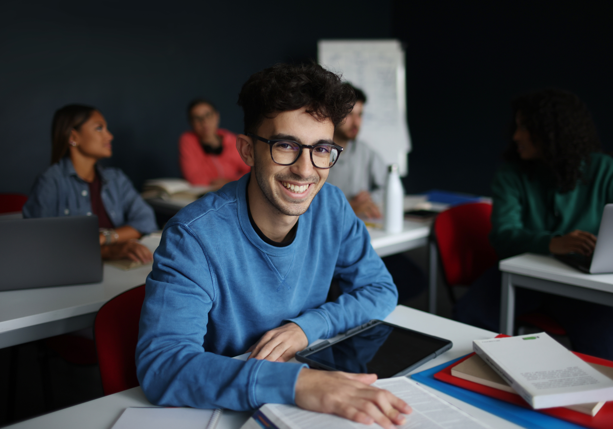 young man sitting at desk