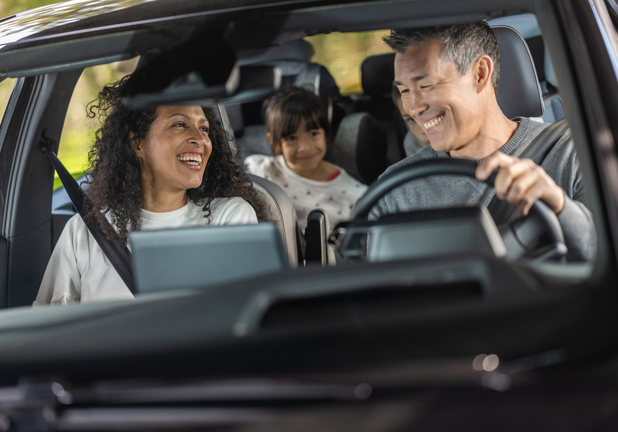 happy family in new SUV