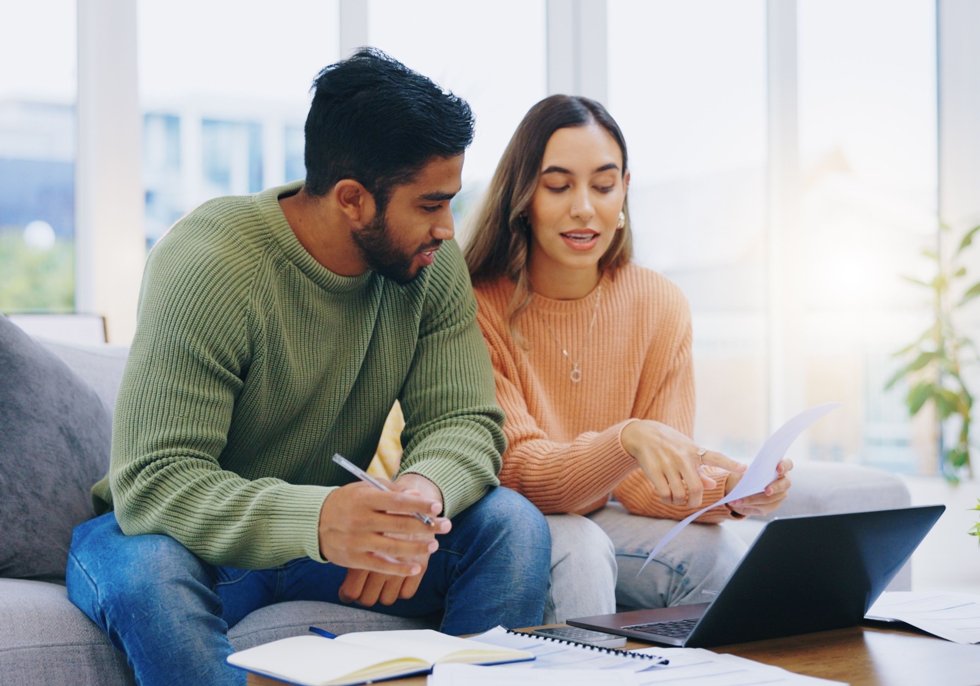 couple reviewing FICO Score on laptop