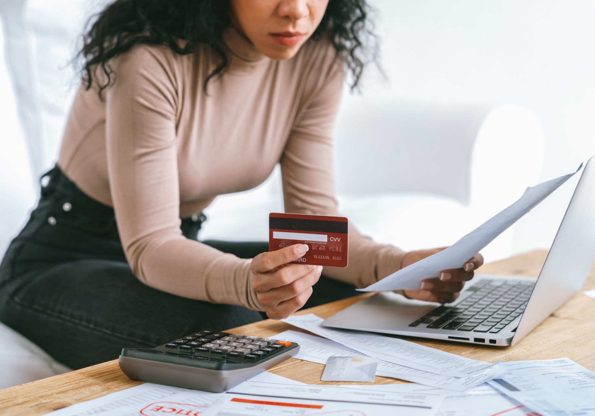 woman looking at credit card statement 