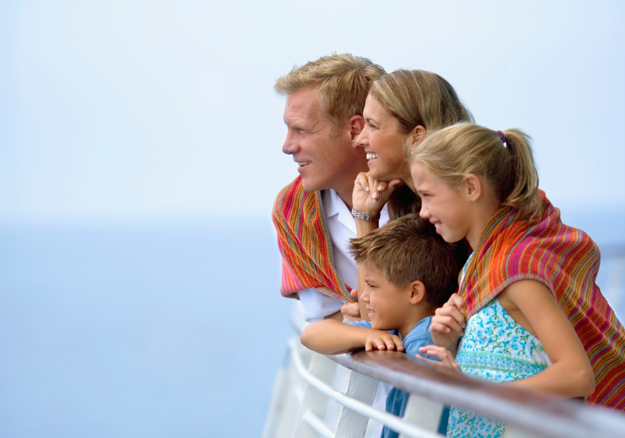 family on cruise ship enjoying the view